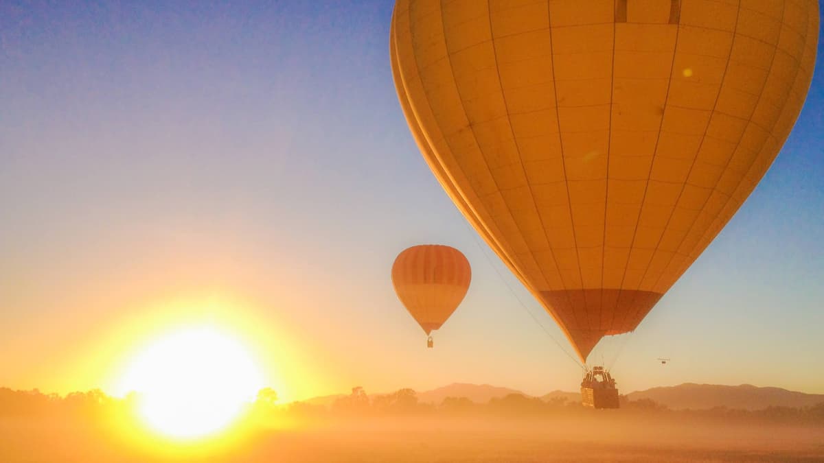 Sunrise Hot Air Balloon Flight near Cairns with Sparkling Wine and Optional Round Trip Transfer