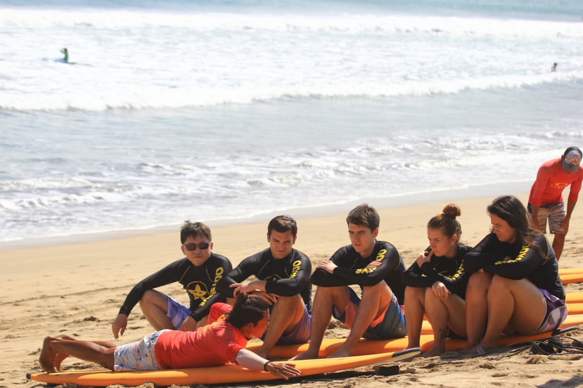 Surfing Lessons by Odysseys Surf School